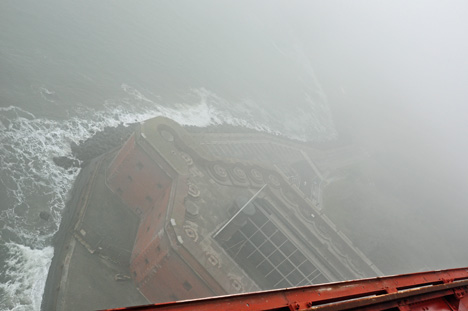 looking down from the side of the bridge